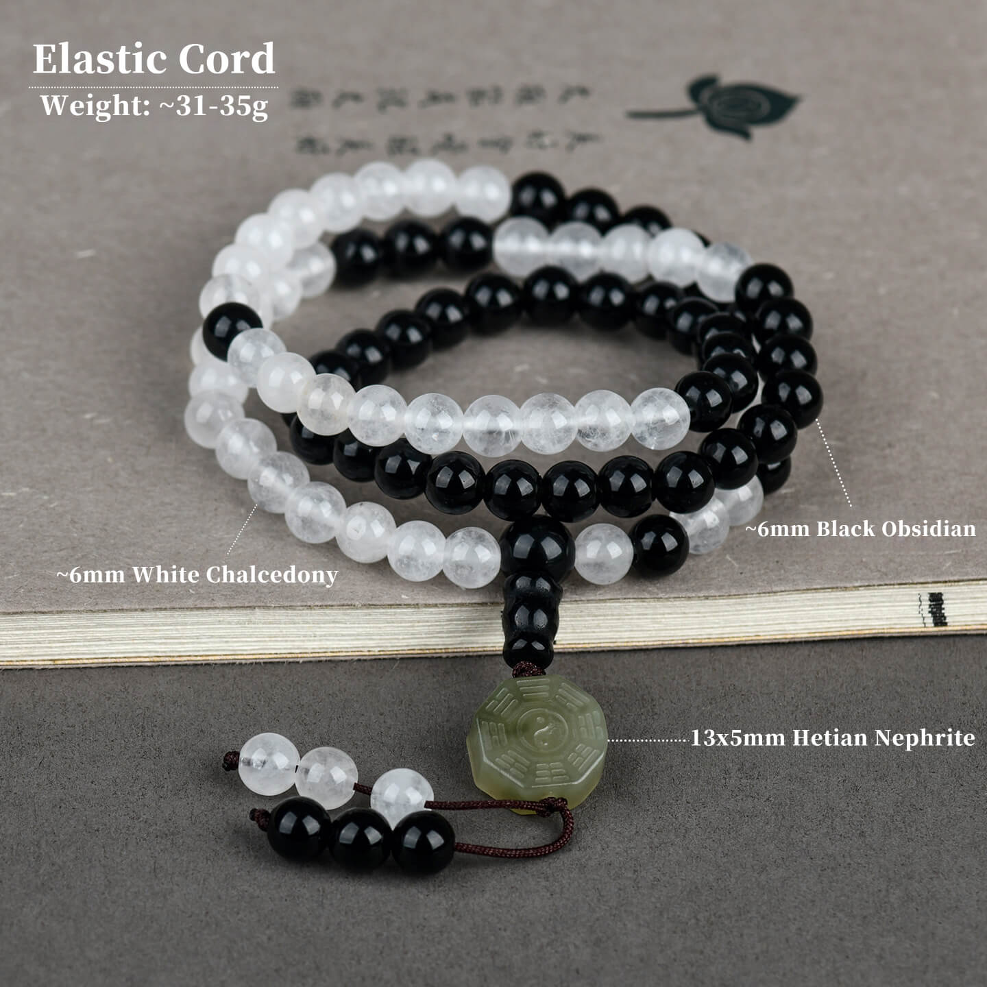 The 81-bead Hetian Nephrite and Obsidian bracelet worn on a wrist, demonstrating its elegant drape, comfortable fit, and how it adds a touch of tranquil, Eastern philosophy to modern style.