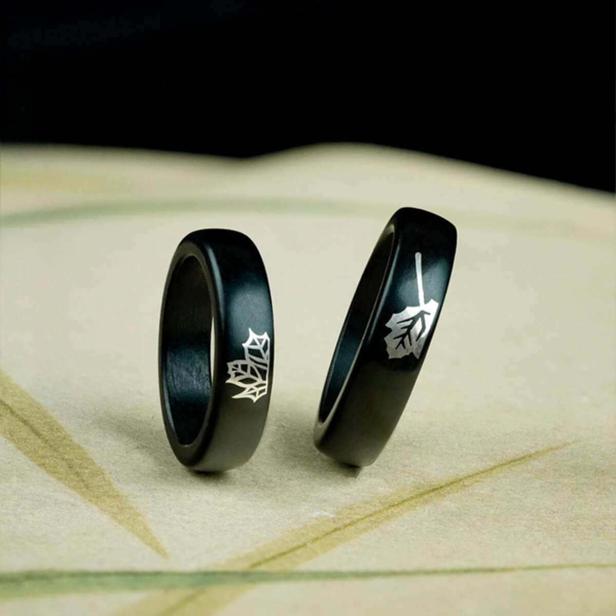 Unity Series - Ebony Couple Rings with a silver maple leaf inlay, interlocking to form one complete leaf.