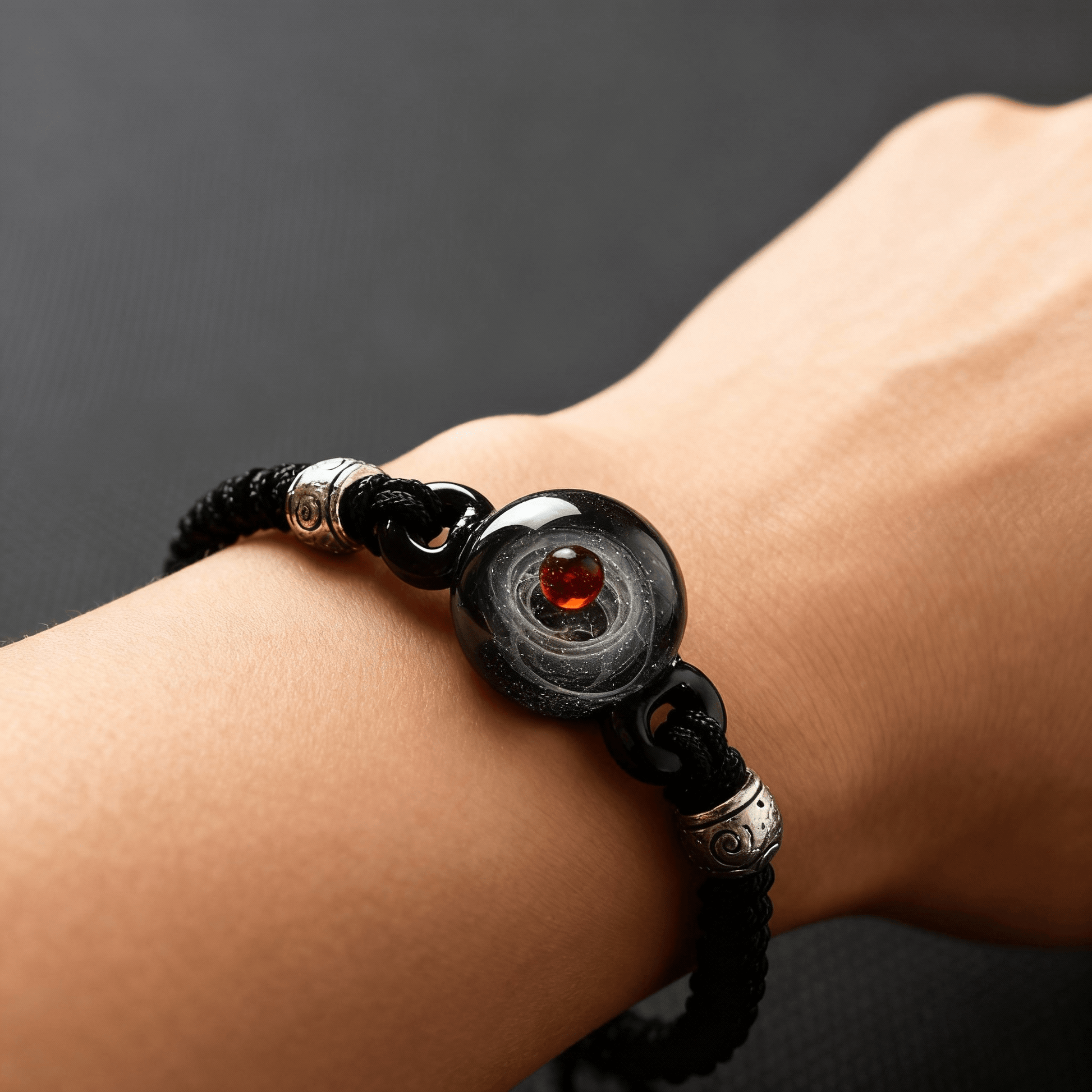 Close-up shot of the Cosmic Sphere Bracelet being worn on a wrist, showcasing how the 3D galaxy beads look in a real-life setting.