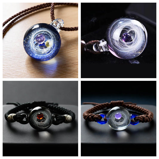The Void Collection Cosmic Sphere series, featuring both the galaxy pendant necklace and the matching bracelet with 3D solar system beads, presented together on a dark background.
